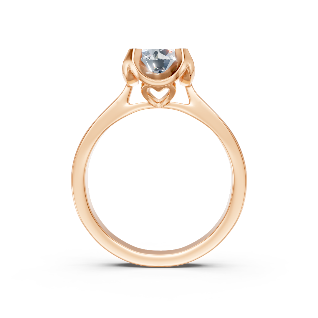 Zaročni prstan iz rdečega zlata Zlatarstvo Gajšek, elegantna oblika in sijoč diamant, prikazan na sliki.