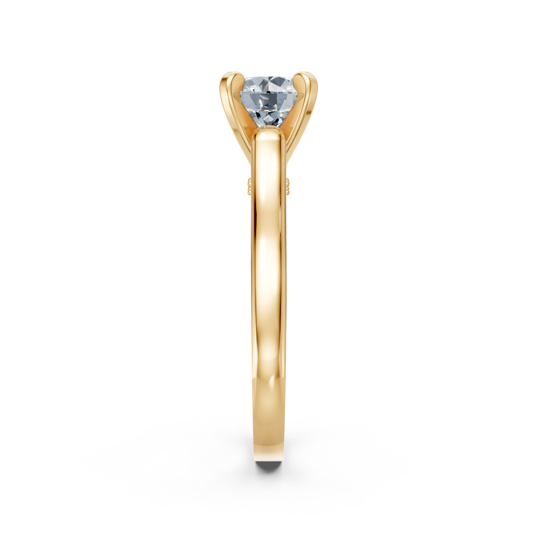 Zaročni prstan iz rumenega zlata Zlatarstvo Gajšek, elegantna oblika in sijoč diamant na sredini.